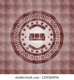 couch icon inside red seamless emblem or badge with abstract geometric polygonal pattern background.