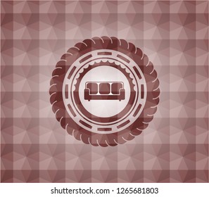 couch icon inside red seamless badge with geometric pattern.