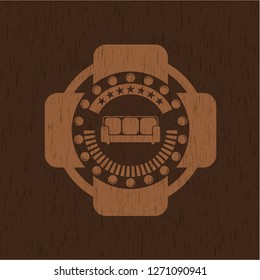 couch icon inside retro style wooden emblem