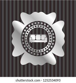 couch icon inside silver badge