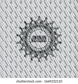 couch icon inside silver badge or emblem. Scales pattern. Vector Illustration. Detailed.