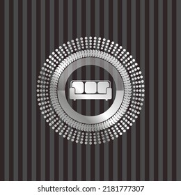 couch icon inside silver emblem. 
