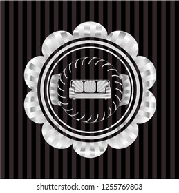 couch icon inside silvery badge or emblem