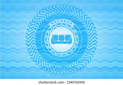 couch icon inside sky blue water emblem background.