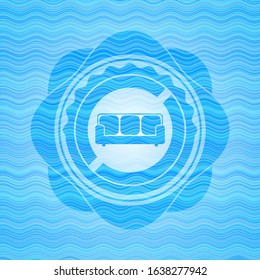 couch icon inside water representation style emblem.