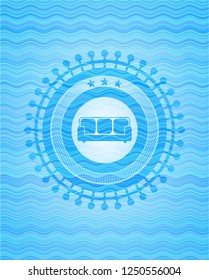 couch icon inside water wave concept style badge.
