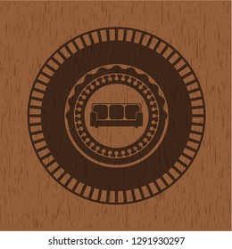 couch icon inside wood emblem. Vintage.
