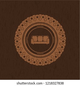 couch icon inside wooden emblem. Retro