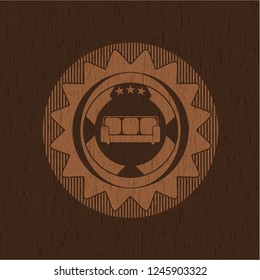couch icon inside wooden emblem. Retro