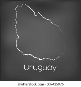 A Country Shape isolated on chalk board with the name and shape of Uruguay