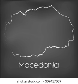 A Country Shape isolated on chalk board with the name and shape of Macedonia