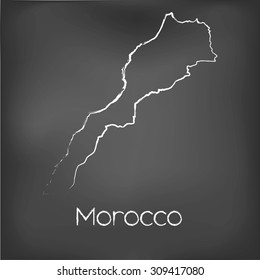 A Country Shape isolated on chalk board with the name and shape of Morocco
