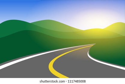 Country side road among mountain valley lead into the green mountain range with sun ray in the sky in the early morning or sunset time for wallpaper,background,banner,backdrop