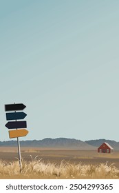 Countryside landscape with log cabin and mountain ranges in autumn season graphic illustration have direction sign pole foreground.