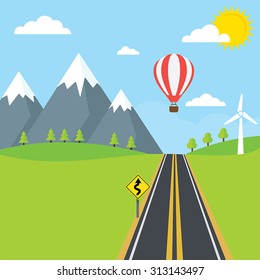 A countryside road with trees and mountains