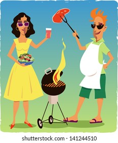 Couple at a barbecue party. Smiling man holding a piece of meat over a flaming grill, woman carrying a bowl of salad and a drink