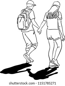 The couple are both in love having a walk holding hand together.