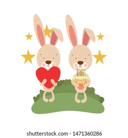 couple of bunnies with cake in hand