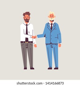 couple businessmen handshaking business partners hand shake during meeting agreement partnership concept male colleagues in formal wear standing together flat full length