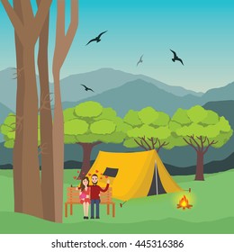 couple camping in forest man and woman with fire in front of the tent and mountain trees at the background