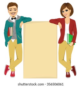 Couple of college students leaning against a blank board with copyspace for text
