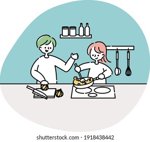 A couple cooking in the kitchen