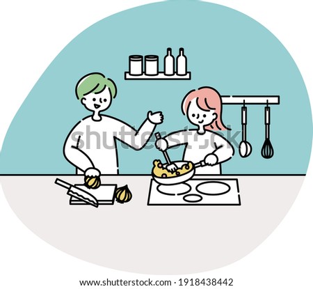 A couple cooking in the kitchen