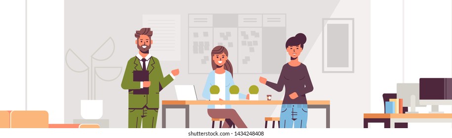 couple coworkers pointing at new female employee introducing hired worker to the team concept modern co-working center office interior flat portrait horizontal