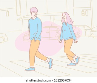 A couple is crossing the crosswalk. hand drawn style vector design illustrations. 