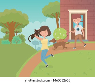 couple with cute little cat and dog in the house garden