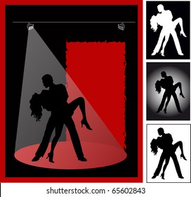 Couple tanzt ein leidenschaftlicher Tango auf schwarzem Hintergrund im Licht der Scheinwerfer