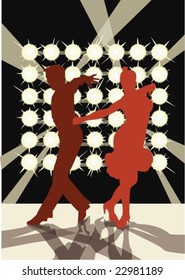 couple dancing in the spotlights on stage