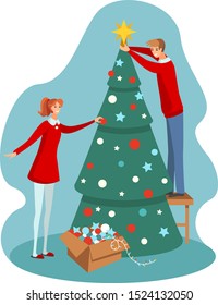 couple is decorating the christmas tree 