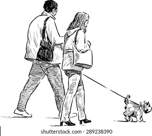 couple with a dog on a walk