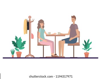 couple drinking coffee in the living room