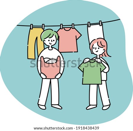 A couple drying their washed clothes