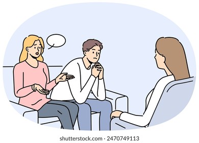 Couple at family therapist in office, sitting on couch talking about problems and quarrels. Woman family therapist helps people get rid of conflicts and misunderstandings in their life together