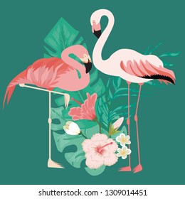 Couple of flamingo standing on tropical leaves