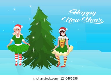 couple girls elf costume near fir tree happy new year merry christmas concept flat horizontal