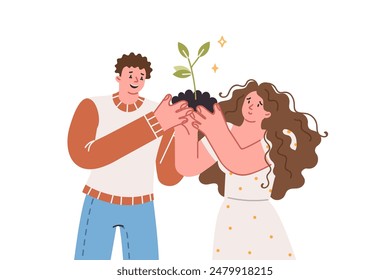 La pareja cultiva un árbol juntos, sosteniendo un puñado de tierra con un árbol en las manos, como metáfora del cuidado de la relación. Preocupación por el medio ambiente de personas que quieren detener la extinción de bosques y parques