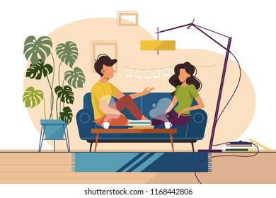 Couple of guy and girl sitting on couch at home