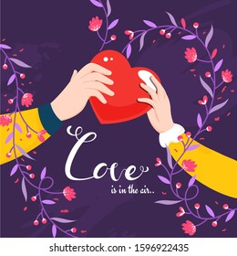 Couple Hand holding Red Heart with Given Message as Love Is In The Air and Floral Motif Decorated on Purple Background.