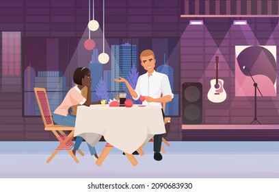 Couple having dinner on live music concert event. Lovely pair spending time on musical evening meal show