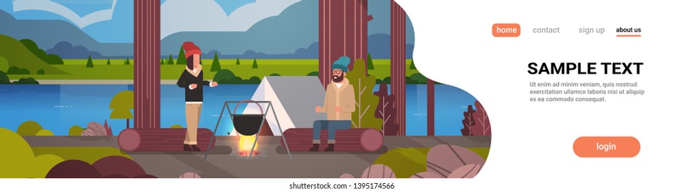 couple hikers sitting on log man woman cooking meals in bowler boiling pot at campfire near camp tent camping concept landscape nature river mountains background horizontal full length copy space