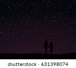 Couple holding hands looking out at the stars