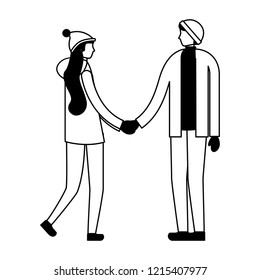couple holding hands with winter clothes