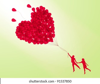 Couple Holding Heart Shape Balloon