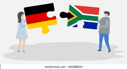 Couple holding two puzzles pieces with German and South African flags. Germany and South Africa national symbols together.