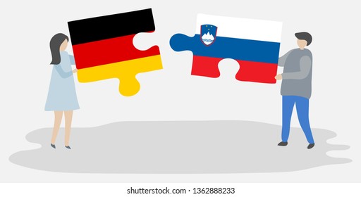 Couple holding two puzzles pieces with German and Slovenian flags. Germany and Slovenia national symbols together.