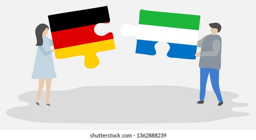 Couple holding two puzzles pieces with German and Sierra Leonean flags. Germany and Sierra Leone national symbols together.